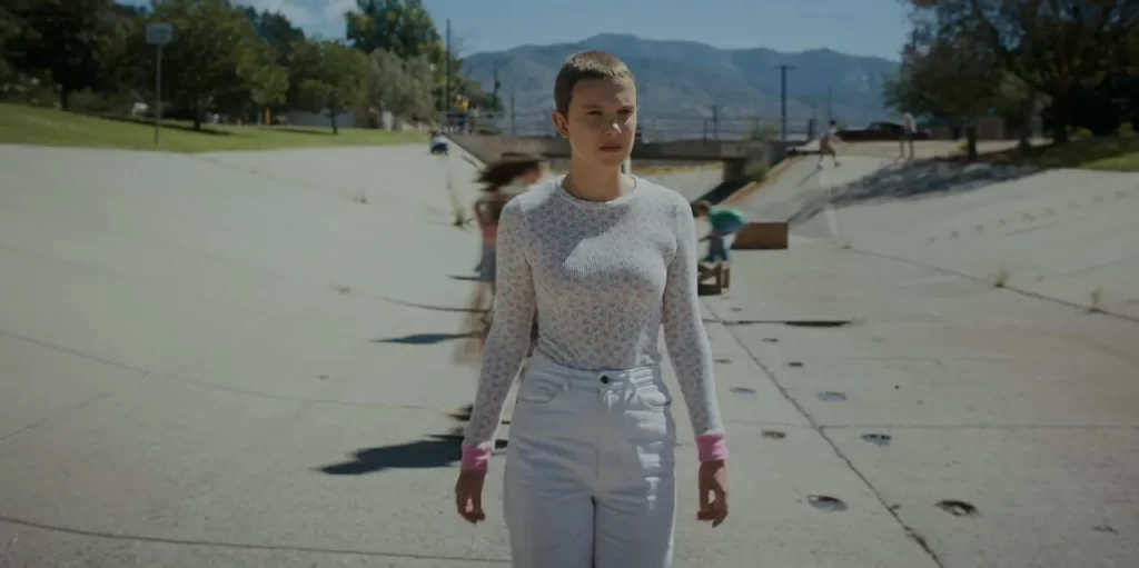 Eleven standing alone at the skatepark in Max’s memory in Stranger Things Season 4.