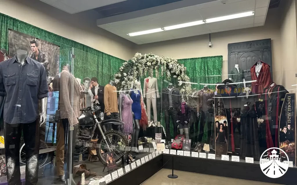 Interior of the Twilight museum in Forks, Washington, featuring costumes, props, and fan memorabilia.