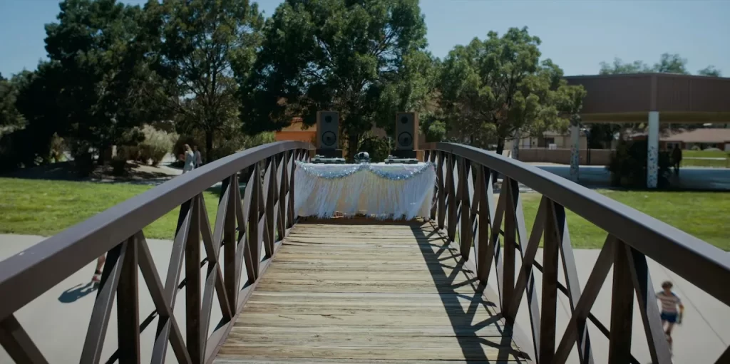 Eleven crosses the bridge and sees the Snow Ball turntable in Stranger Things Season 4.