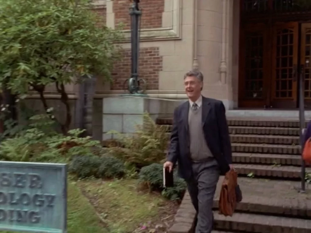 David Dukes as Professor Miller steps out of Miller Hall, which is identified as Wimser Psychology Building in Rose Red.
