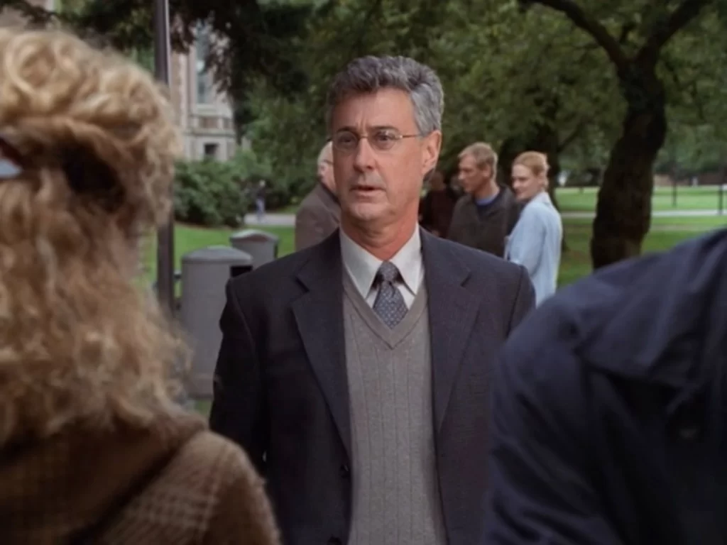 Professor Miller speaks to Joyce and Steve outside Miller Hall (Wimser Psychology Building) in the University of Washington quad, with the rest of the group behind him.